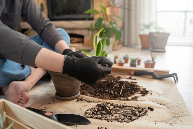 Side view hands wearing gardening gloves