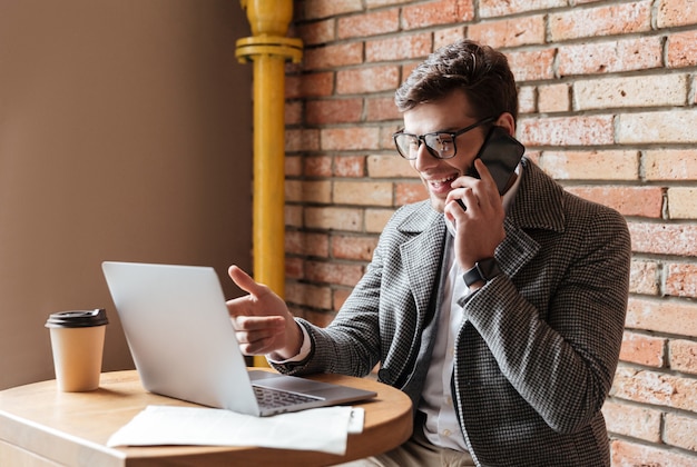 Side view of happy businessman in eyeglasses