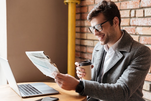 Side view of happy businessman in eyeglasses