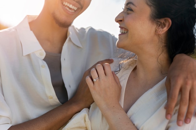 Side view happy couple holding hands