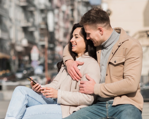 side view of happy couple outdoors