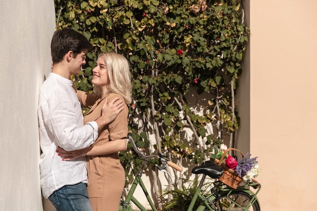 Side view of happy couple posing while on a walk