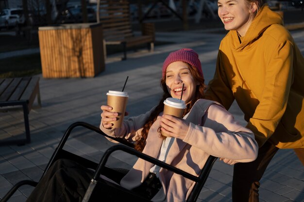 Side view happy friends with coffee cups