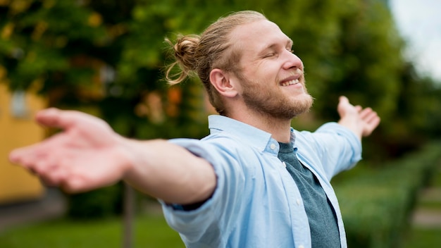 Side view of happy man outdoors