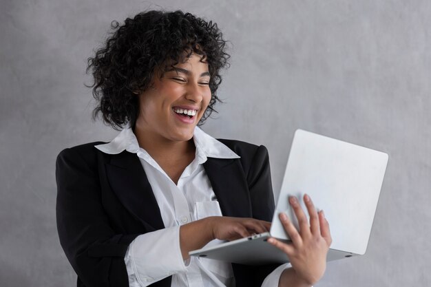 Side view happy woman with laptop