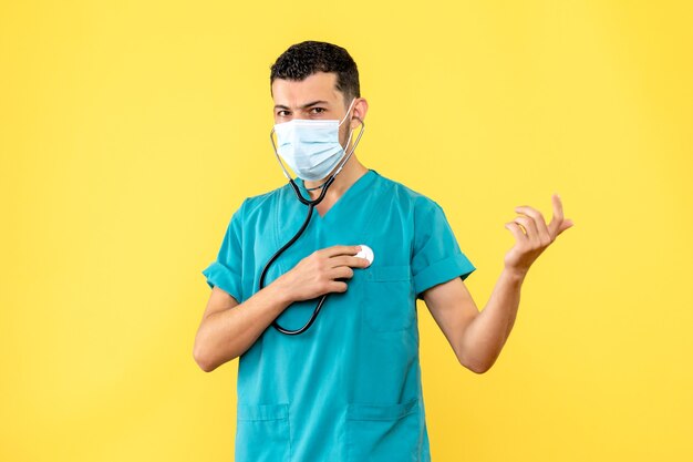 Side view infectious disease specialist a doctor with phonendoscope in the mask