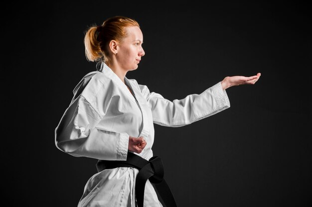 Side view of karate fighter practicing