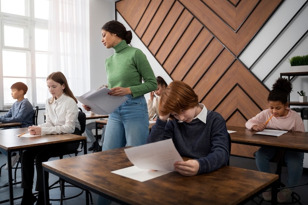 Side view kid cheating at school test