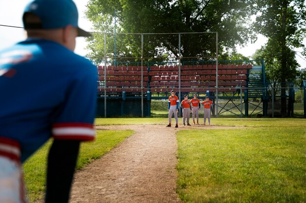 Side view kid waiting on field