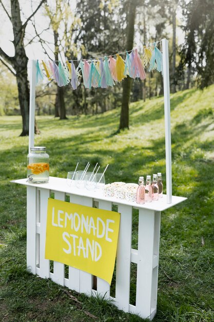 Side view lemonade stand with popcorn