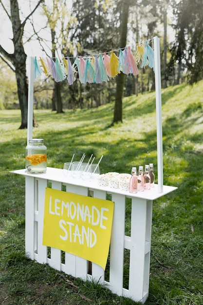 Side view lemonade stand with popcorn