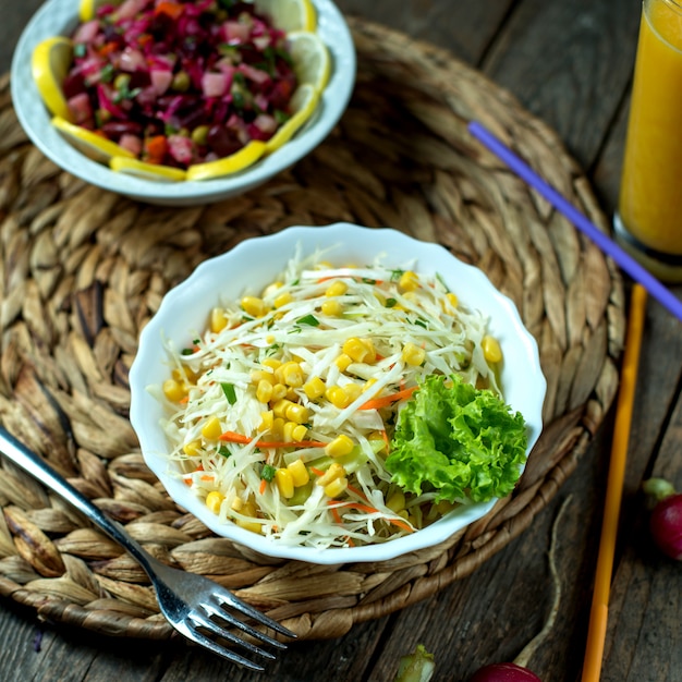 Side view light coleslaw with corn lettuce and radish