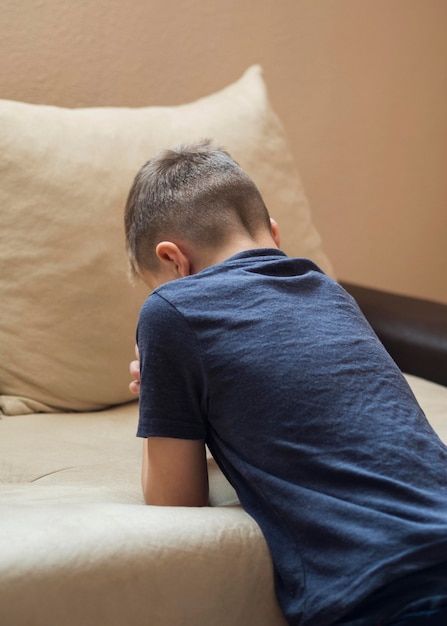 Free photo side view of little boy praying