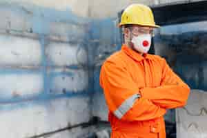 Free photo side view of male laborer with hard hat and copy space