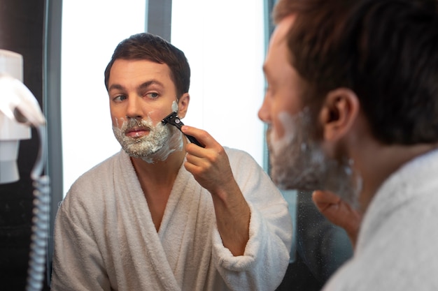 Side view man in bathroom