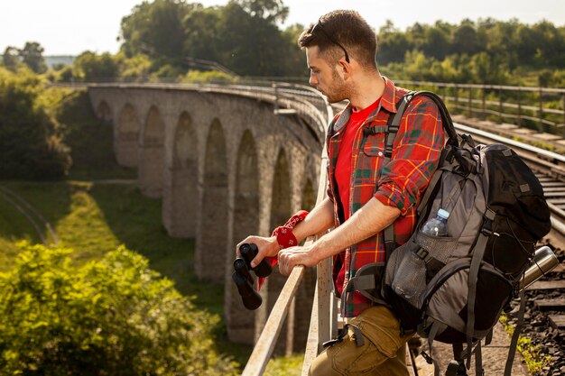 Side view man on bridge