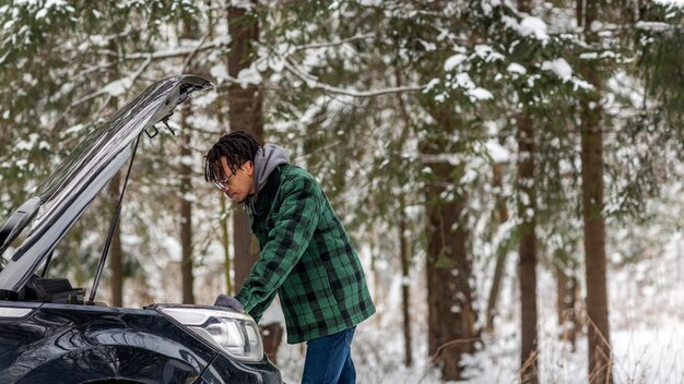 Side view man checking car