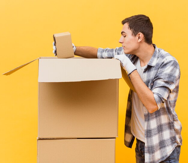 Side view man checking packages