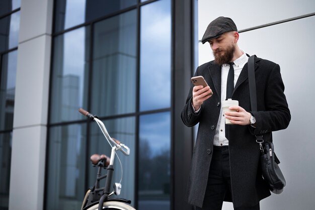 Side view man checking phone