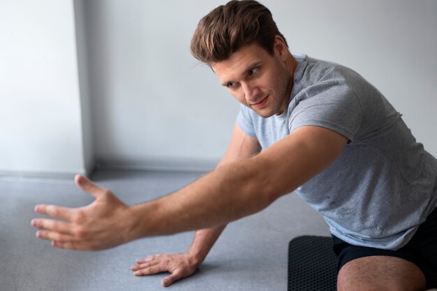 Side view man doing pilates