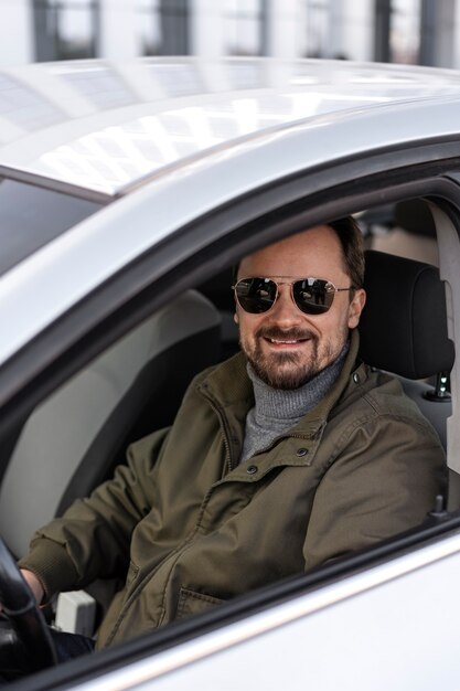 Side view man driving car