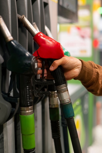 Side view man at gas station