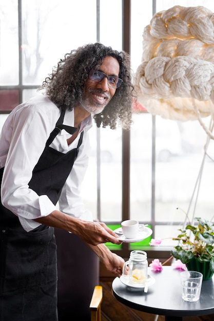 Side view man holding coffee cup