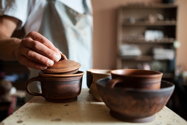 Side view man holding lid