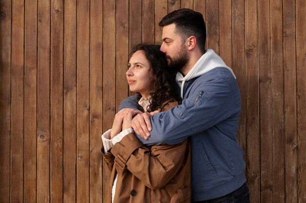 Side view man holding woman