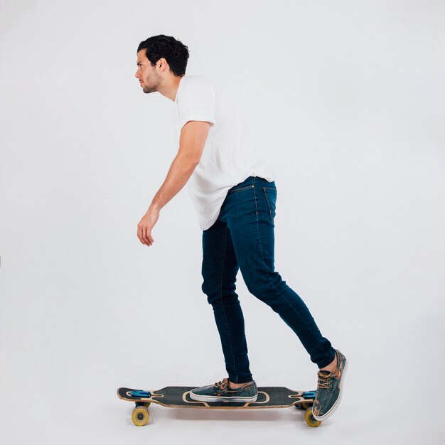 Side view of man on longboard