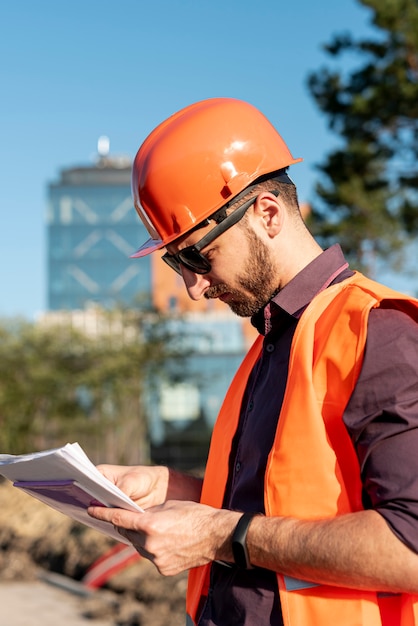 Side view man looking at documents