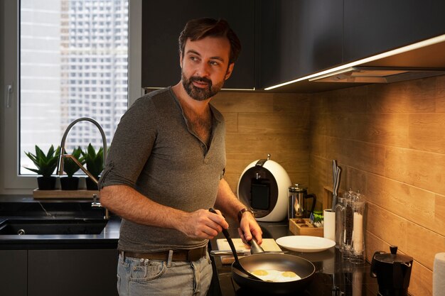 Side view man making breakfast