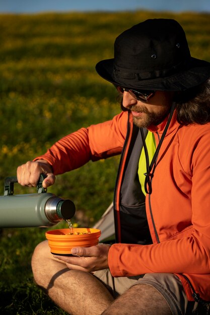 Side view man making instant soup