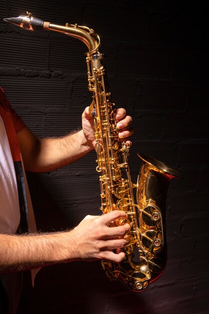 Side view of man playing saxophone