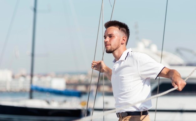 Side view man posing outdoors