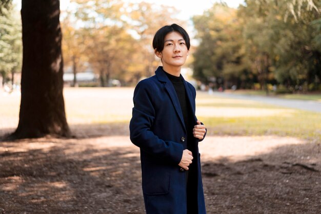 Side view of man posing in the park