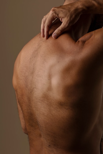 Side view man posing in studio