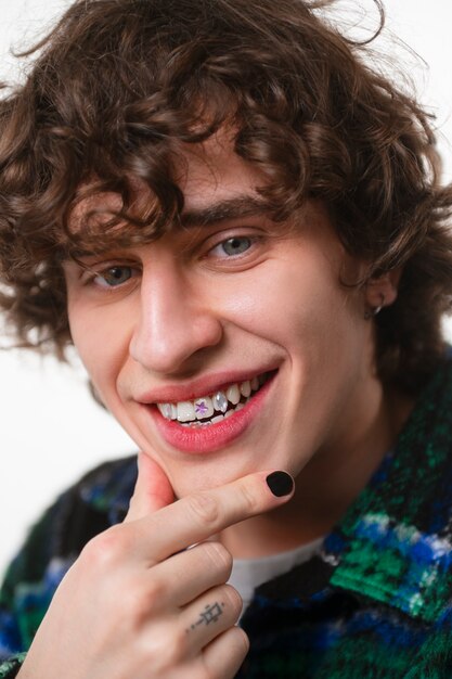 Side view man posing with dental gems