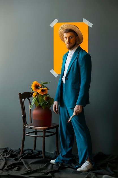 Free photo side view man posing with sunflowers