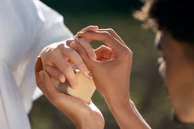 Side view man proposing to girlfriend