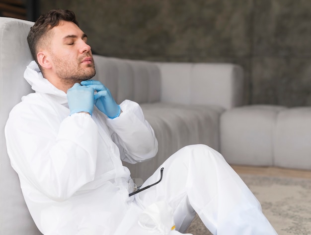 Side view man in suit sitting