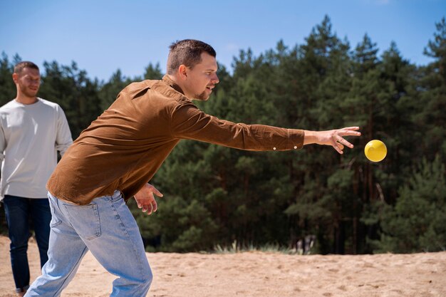 Side view man throwing ball