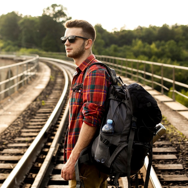 Side view man on trail rail