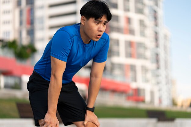 Side view man training outdoors