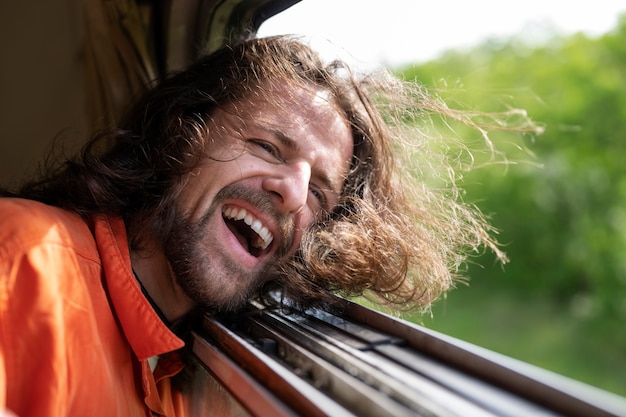 Side view man traveling by train