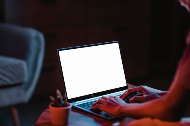 Side view of man using laptop