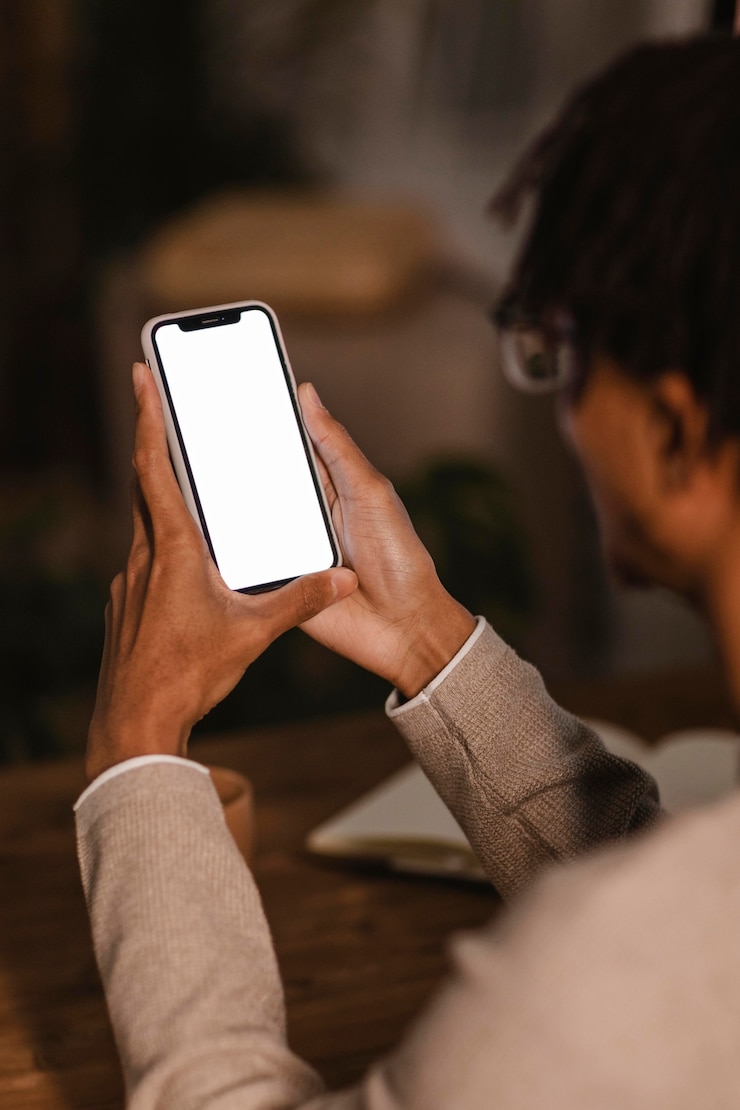 Free Photo side view of man using modern smartphone device