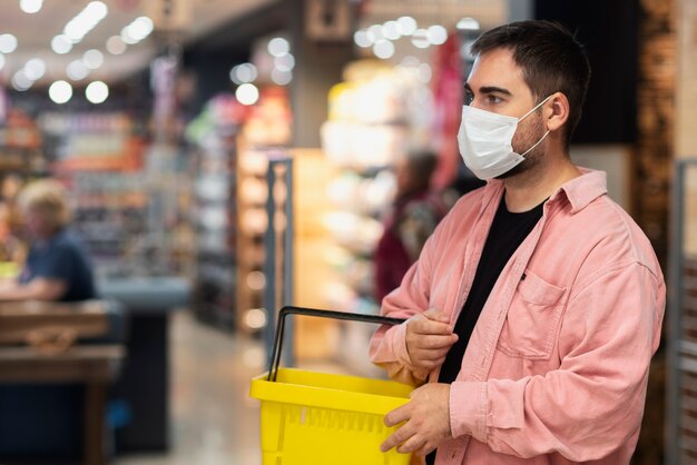 Side view man wearing face mask