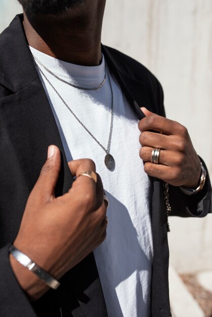 Side view man wearing necklace