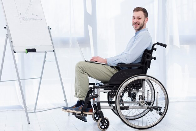 Side view man in wheelchair